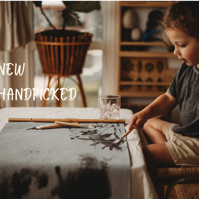 a kid painting on magic canva