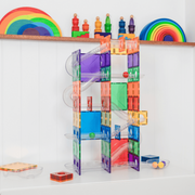Colorful Magnetic marble run toy bundle set on a white surface with shelves in the background