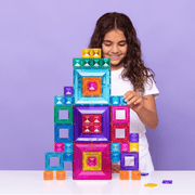 Child playing with Connetix Tiles Bright Portal Pack colorful magnetic building blocks against a purple background